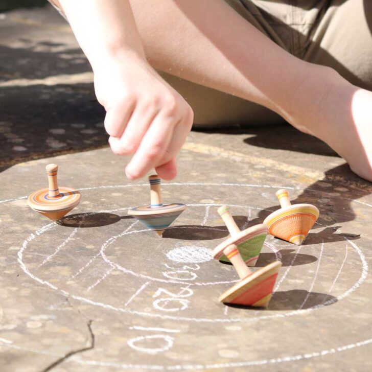 wooden spinning tops game