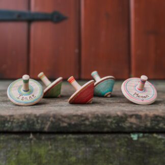 love heartwood wooden spinning top toy