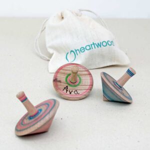 set of 3 wooden spinning tops in a bag
