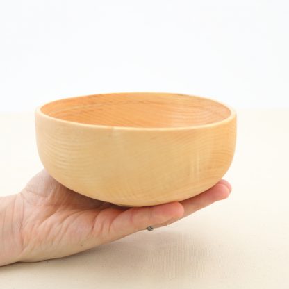 side view of a handmade oval wood bowl