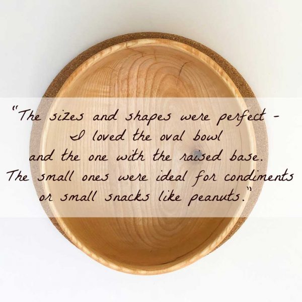 top view of an oval wooden bowl with a testimonial