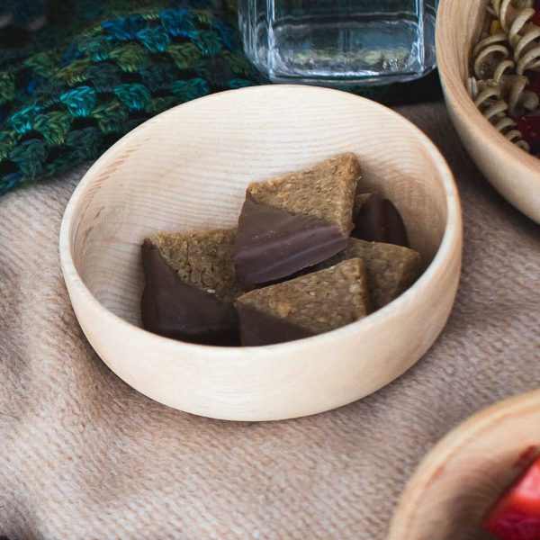 wooden bowl with vegan chocolate flapjacks