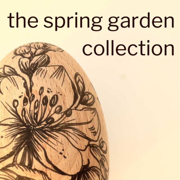 wooden egg with flower design in black ink