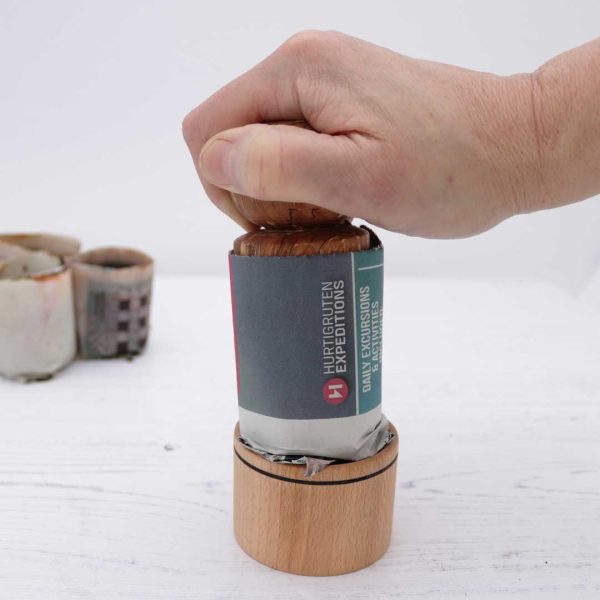 using a seed pot press to make a recycled paper seed pot
