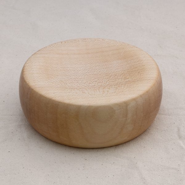 Chunky, round wood base for spinning tops.