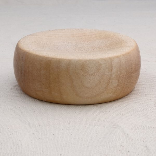 a side view of a wooden spinning top base made from sycamore wood