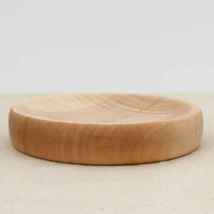 Smooth, polished round wooden spinning top base.