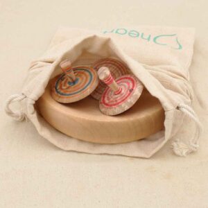 Large wooden spinning top base made from sycamore wood in a cotton drawstring bag.