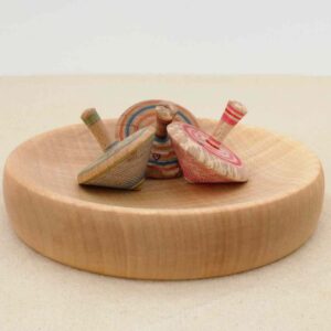 Durable and polished wooden base for spinning tops.