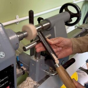 turning a wooden ring box on a lathe.