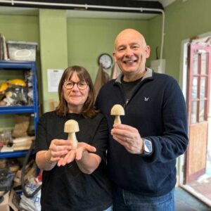 happy husband and wife on a woodturning experience session.
