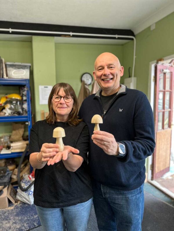 happy husband and wife on a woodturning experience session.