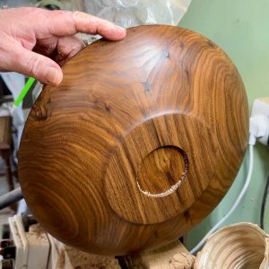 wet sanding a wooden rattle using oil