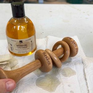 oiling a wooden rattle