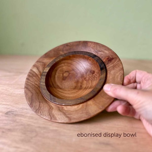 Inside of an elm display bowl with an ebonised rim.