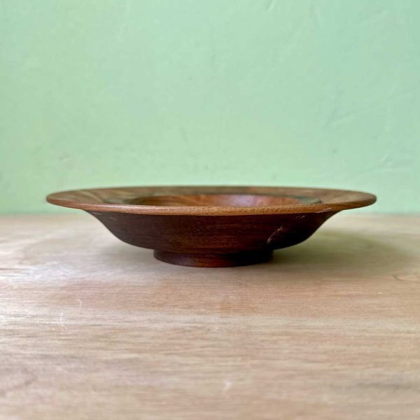An ogee shaped, ebonised elm bowl.