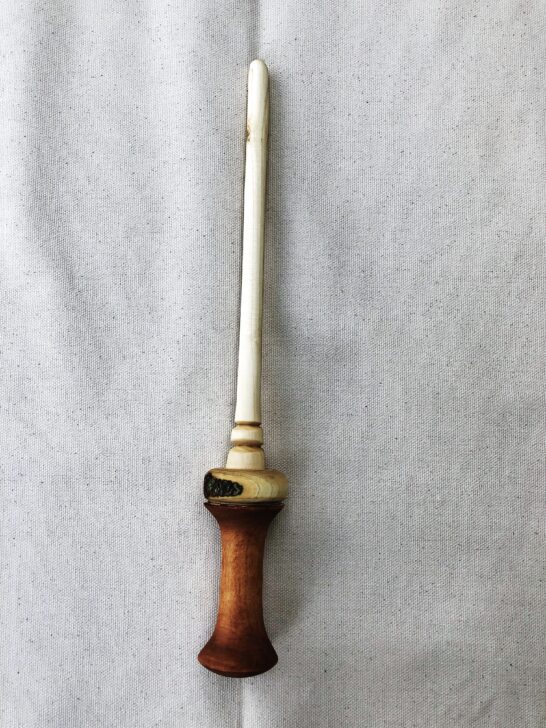 A wooden wand featuring a chestnut handle