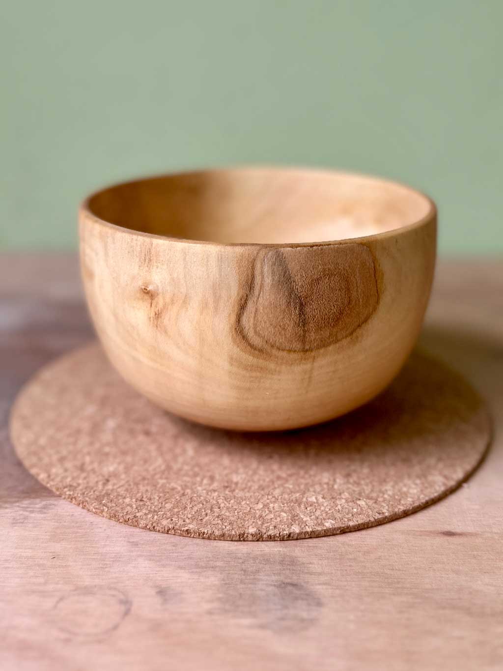 Pale coloured end grain Rowan wood bowl with a patch of under bark remaining on the side.