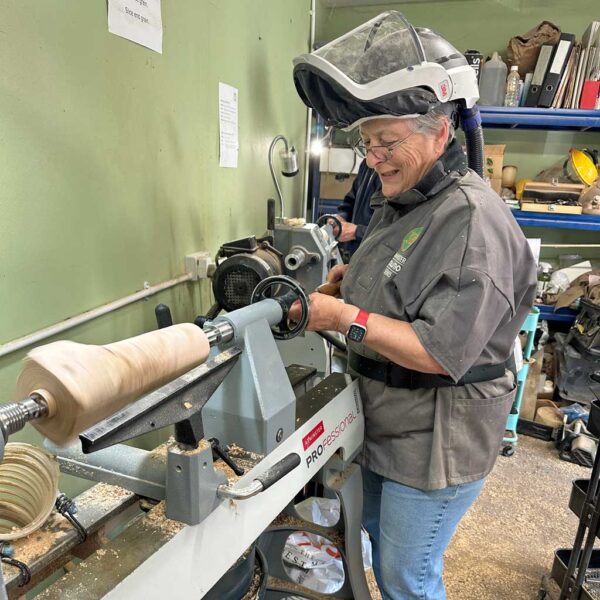 Long-hole boring through a wooden table lamp for the electrical cable.