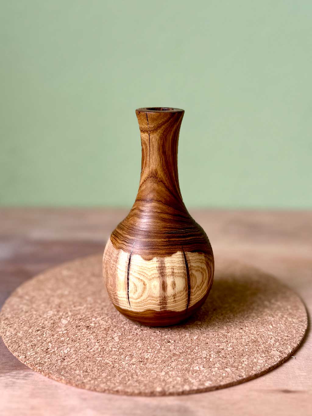 Short Laburnum bud vase with tall neck and bulbous base.