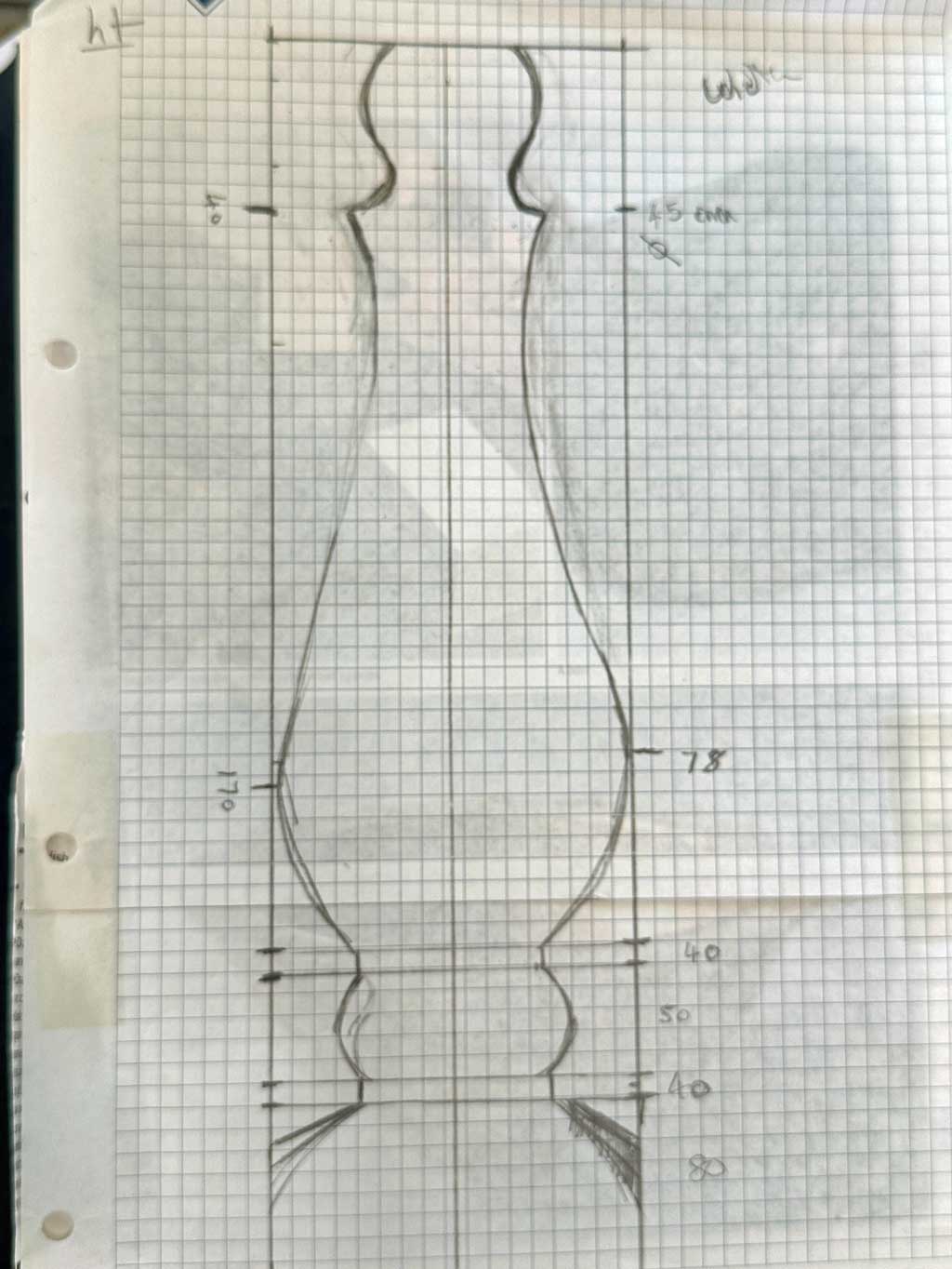 Pencil profile drawing of a table lamp design on graph paper