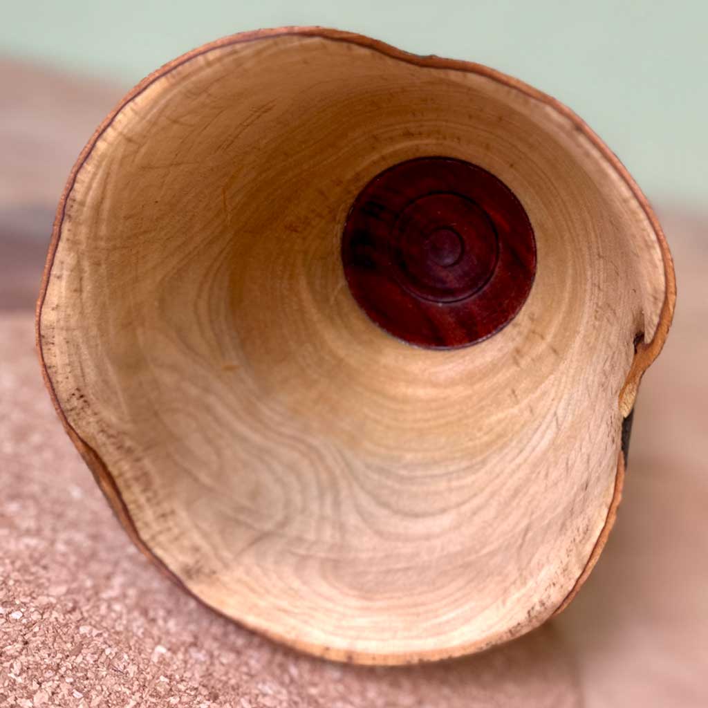 Interior of the Unfolding vessel highlighting the natural bay wood heartwood.